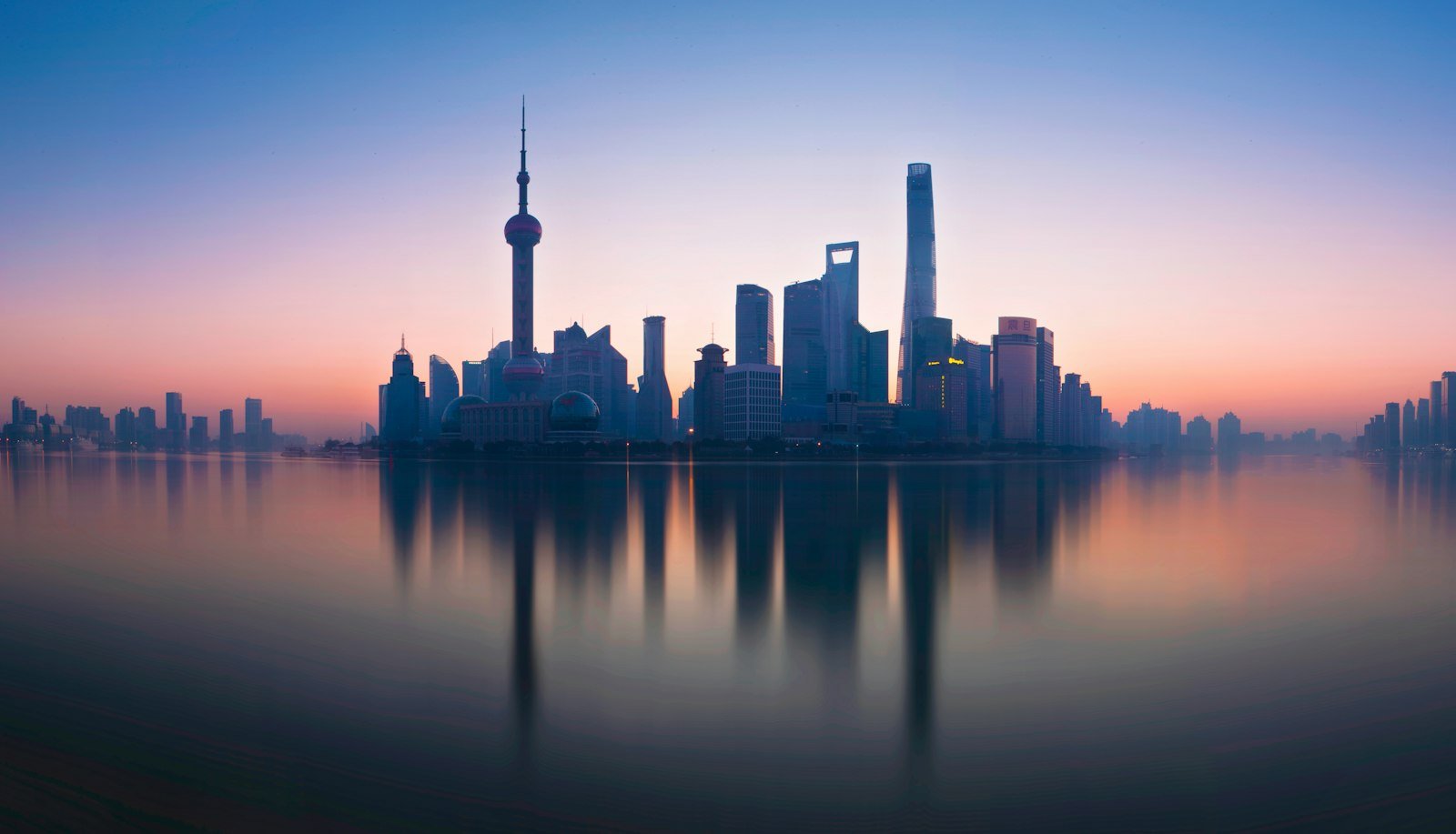 Shanghai skyline reflecting in the river